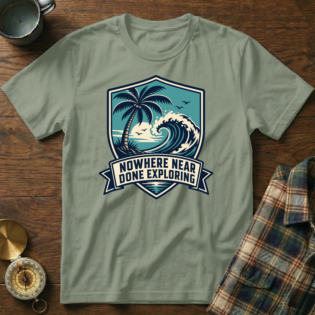 T-shirt with a coastal graphic and text "NOWHERE NEAR DONE EXPLORING".