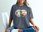 T-shirt graphic with overlapping circles: "Sleep in" and "Go hiking" with "Regret" in the overlap.
