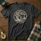 A black t-shirt features a circular graphic of a fish wearing sunglasses lounging on a beach chair.