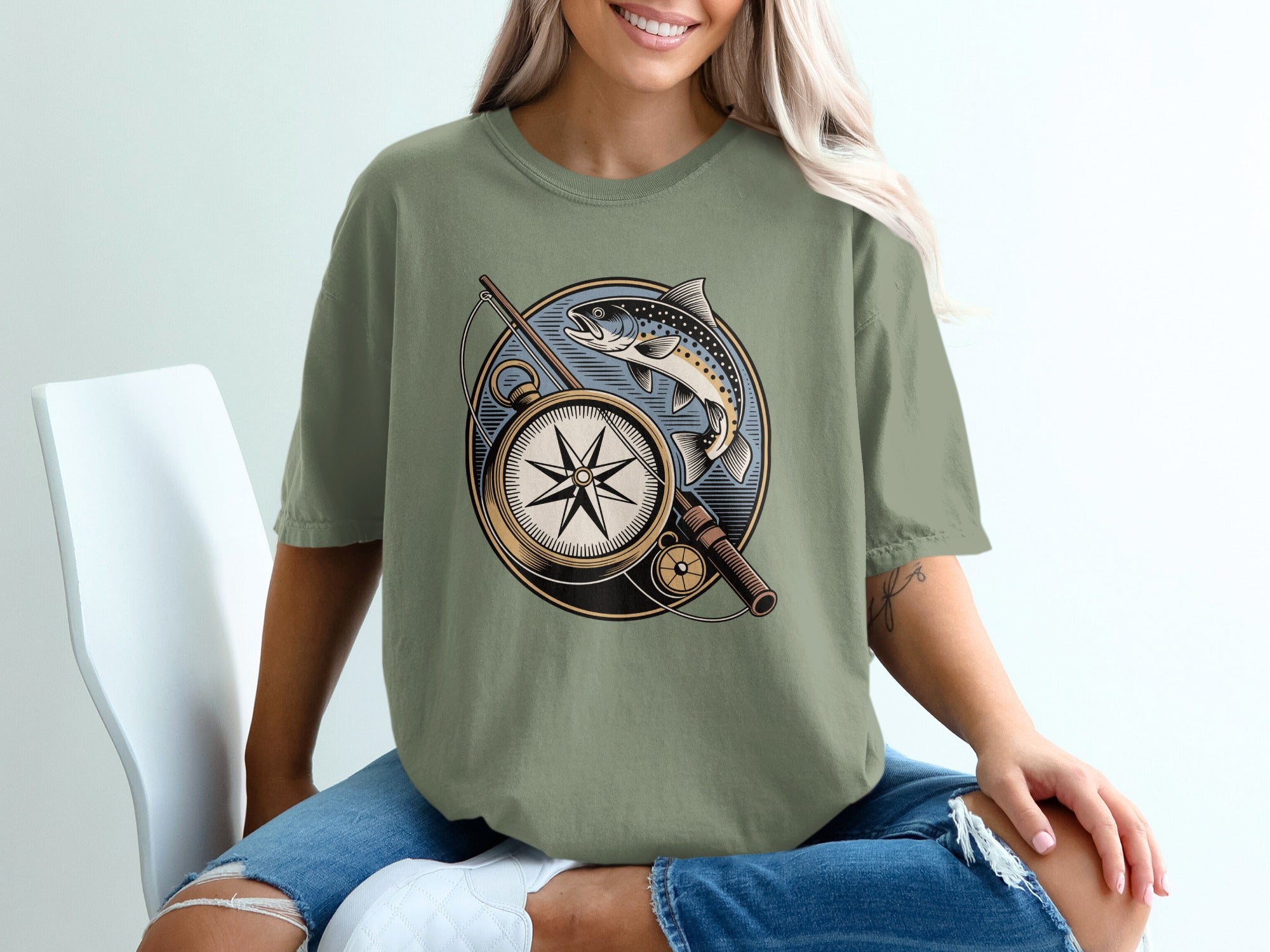 Olive green t-shirt with fishing compass and trout graphic.