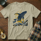 T-shirt with whale breaching in stylized blue waves.