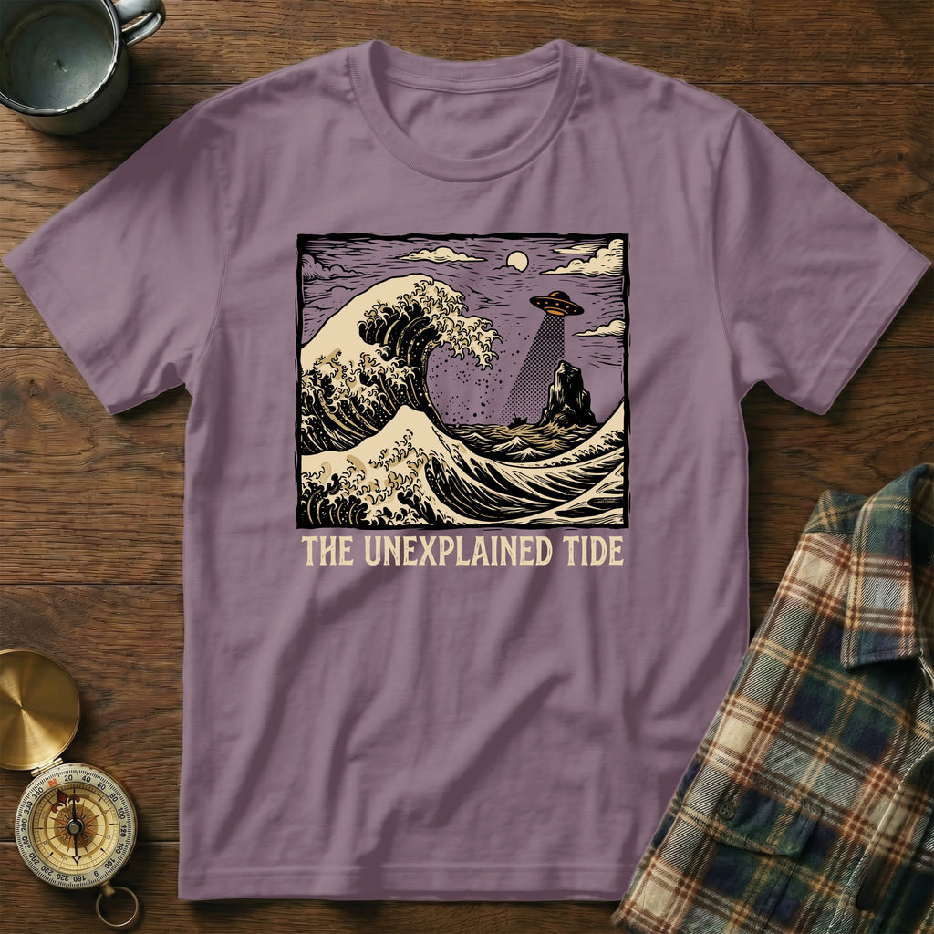 Purple t-shirt with "The Unexplained Tide" and a UFO over a crashing wave.