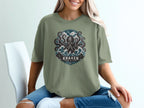 T-shirt with a kraken illustration, waves, birds, and text "Kraken Beyond the Depths".