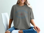 Grey t-shirt with "HOMEGROWN WANDERER" text and compass graphic.