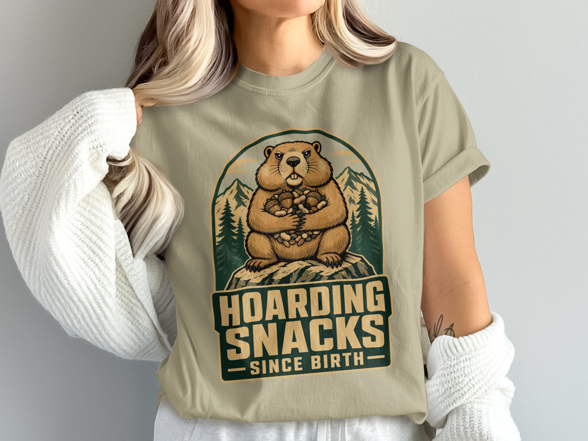 Groundhog hoarding nuts with text "Hoarding Snacks Since Birth."