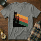 Graphic t-shirt featuring stylized pine trees and colorful retro stripes.