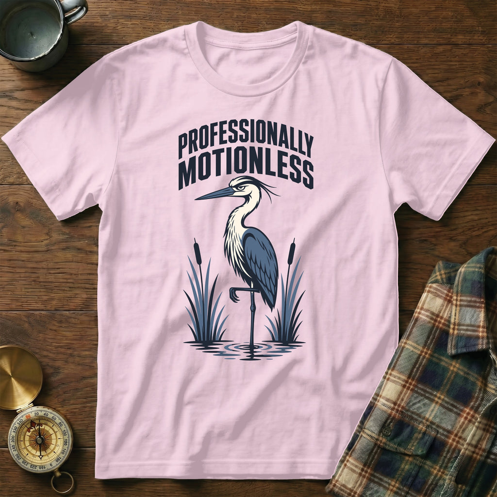 Pink t-shirt with a graphic of a heron and text "PROFESSIONALLY MOTIONLESS."
