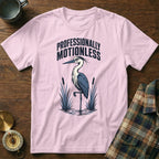 Pink t-shirt with a graphic of a heron and text "PROFESSIONALLY MOTIONLESS."