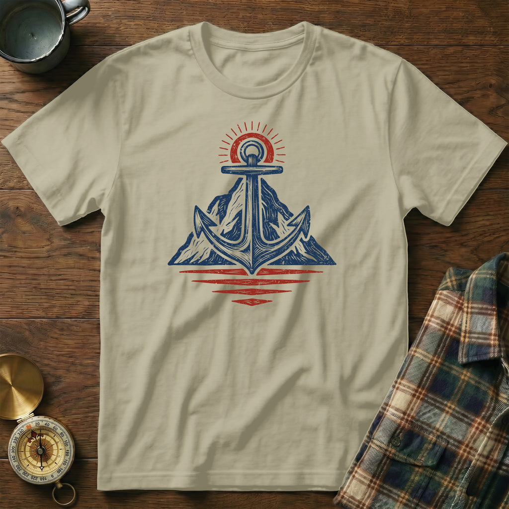 Tan t-shirt with anchor, mountain, sun, and water graphic.