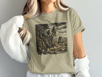 Bigfoot stands on a rocky cliff overlooking a stormy sea, sketch art.