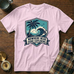 Pink t-shirt with a shield graphic of a palm tree, wave, and sun text "NOWHERE NEAR DONE EXPLORING".