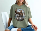 Bigfoot taking a selfie in front of mountains, text reads "WHO'S BLURRY NOW?"