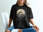Black t-shirt with "COASTLINE FREQUENCY" and circular wave design.