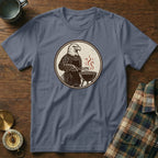 Eagle wearing an apron grilling with tongs and a barbecue on a t-shirt.