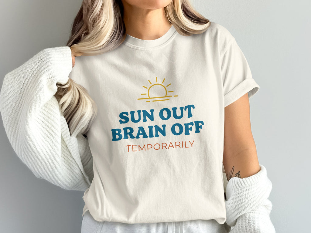 Cream t-shirt with "SUN OUT BRAIN OFF TEMPORARILY" text and a sun graphic.