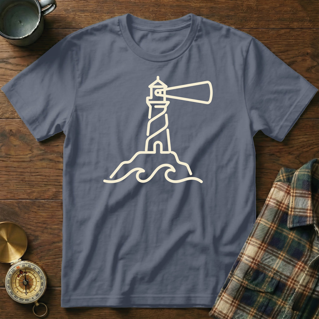 Blue t-shirt with cream outline graphic of a lighthouse on waves.