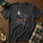 Black t-shirt with a graphic of an eagle wearing sunglasses relaxing on an inner tube with a drink.
