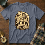 T-shirt with a cartoon turtle wearing sunglasses walking with "SLOW IS THE WHOLE POINT" text.