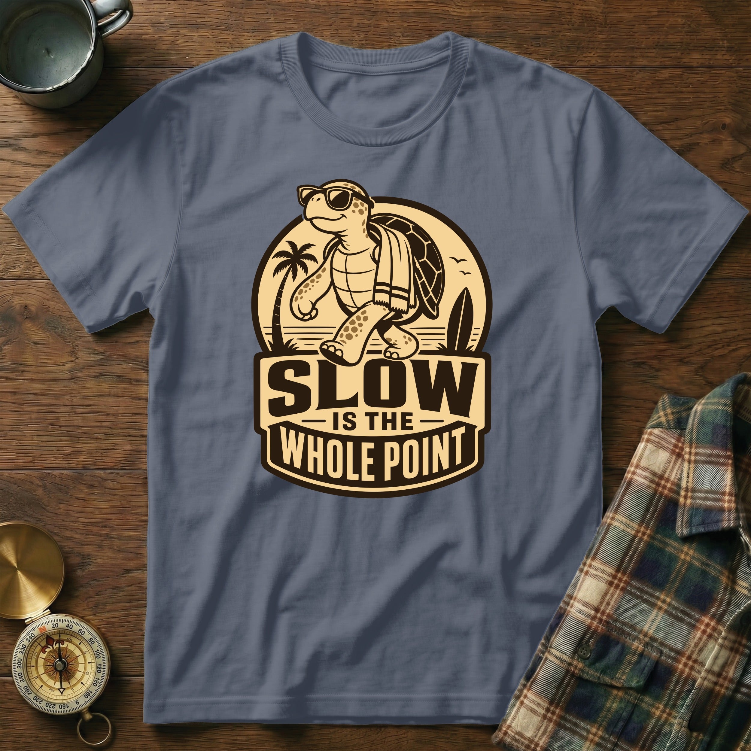 T-shirt with a cartoon turtle wearing sunglasses walking with "SLOW IS THE WHOLE POINT" text.