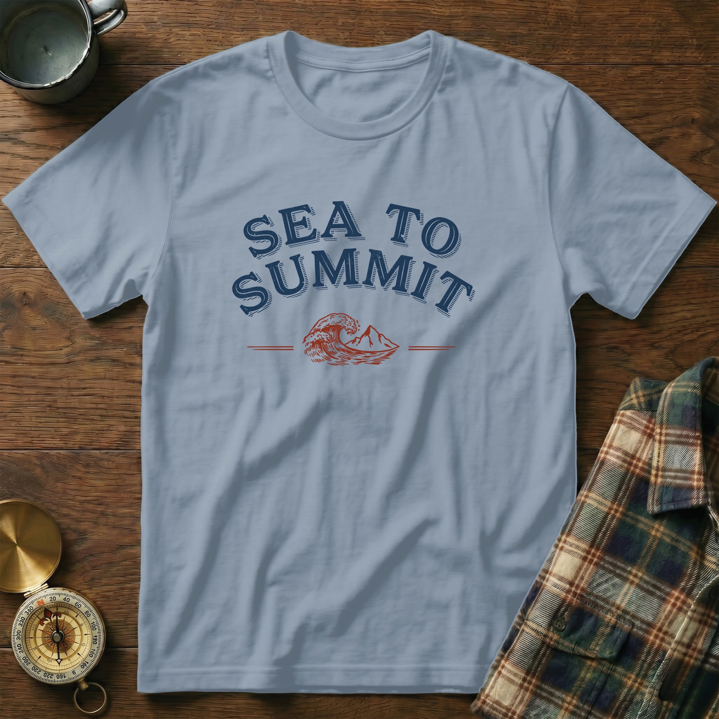 Light blue t-shirt with "SEA TO SUMMIT" text and mountain wave graphic.