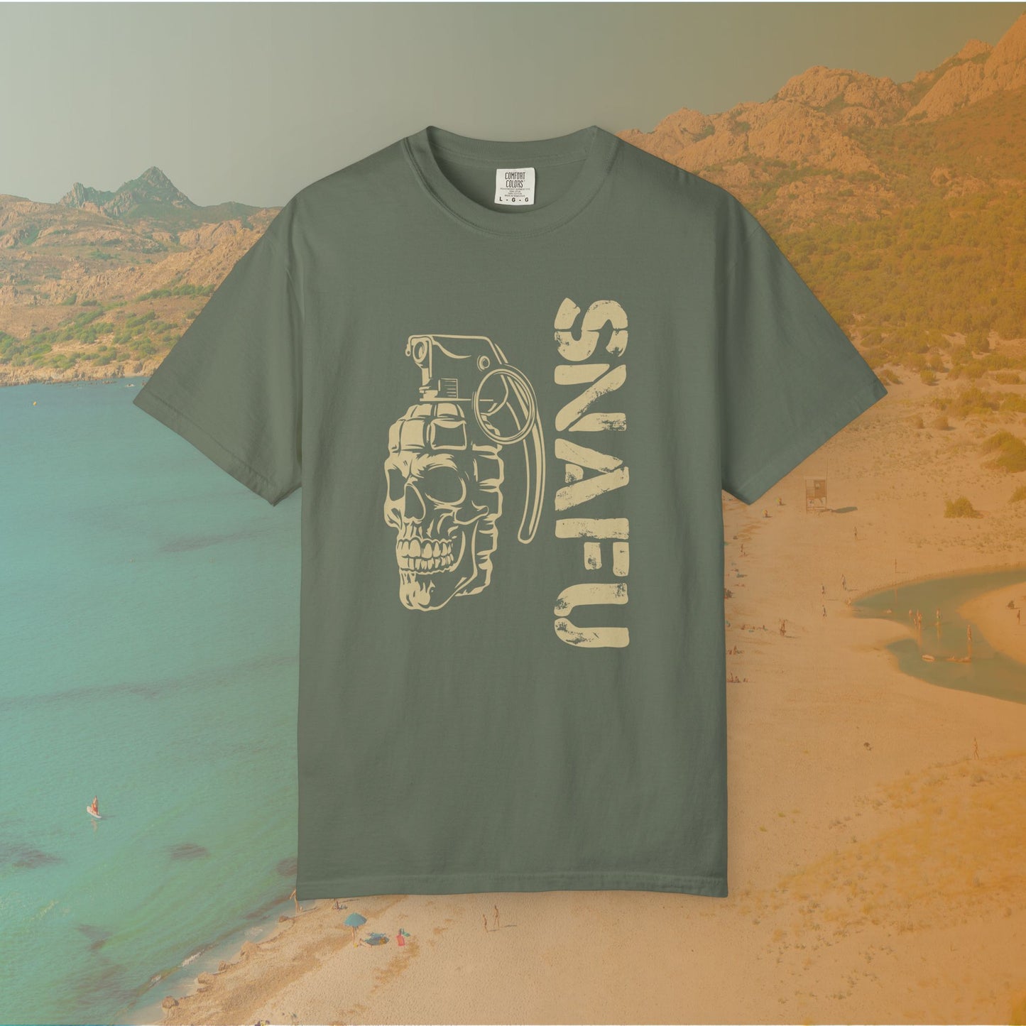 green Graphic T-shirt featuring a stylized image of a skull merged with a hand grenade, positioned next to the large, distressed text "SNAFU."