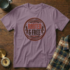 Purple t-shirt with "ROOTED & FREE" graphic in a circular emblem.