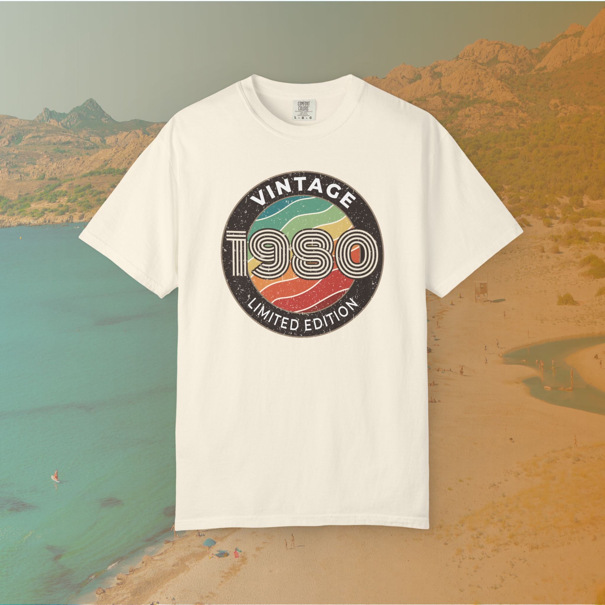 White t-shirt with 'Vintage 1980 Limited Edition' design on a scenic background