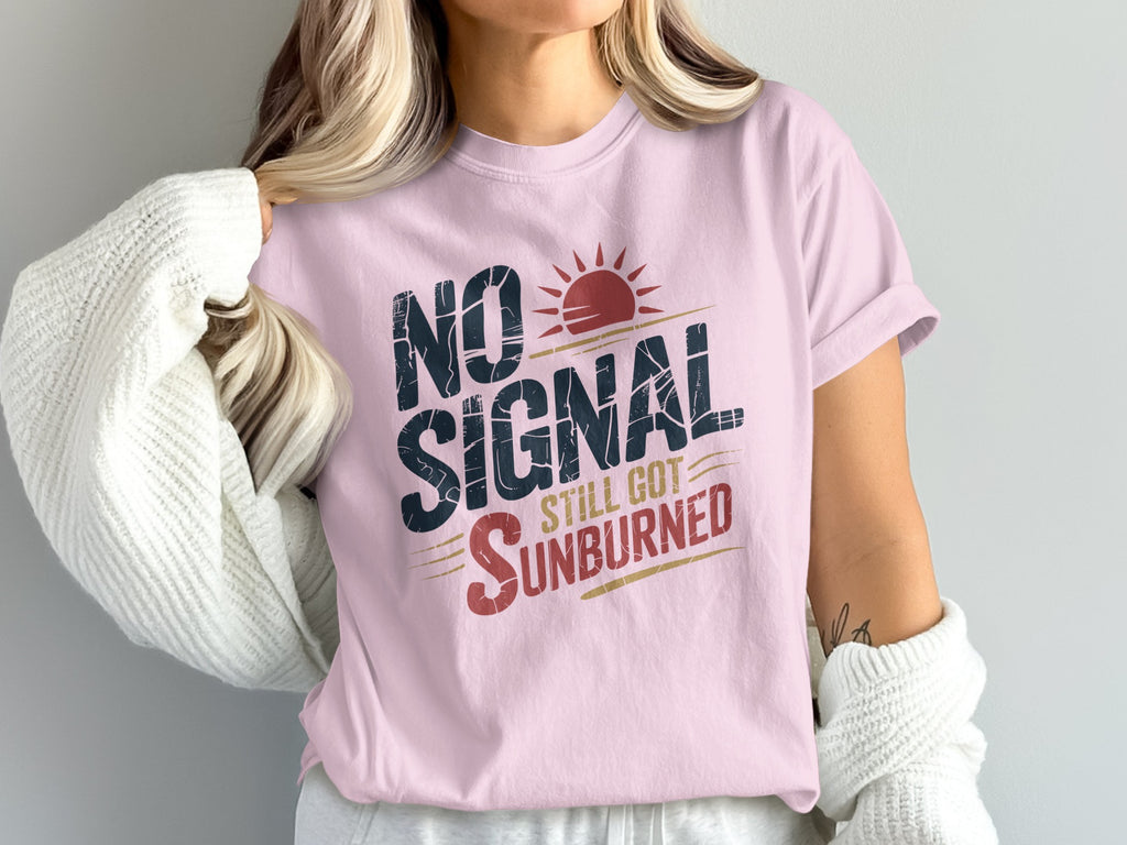 Pink t-shirt with "NO SIGNAL STILL GOT SUNBURNED" text and sun graphic.