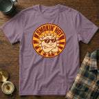 Purple t-shirt with a circular graphic of a cool sun wearing sunglasses and the text "Smokin' Hot."