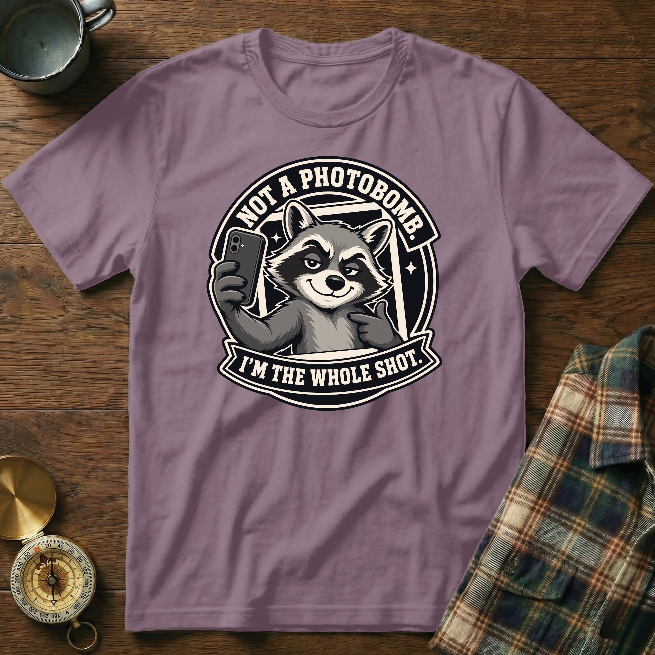 T-shirt with a raccoon holding a phone, saying "Not a photobomb. I'm the whole shot."