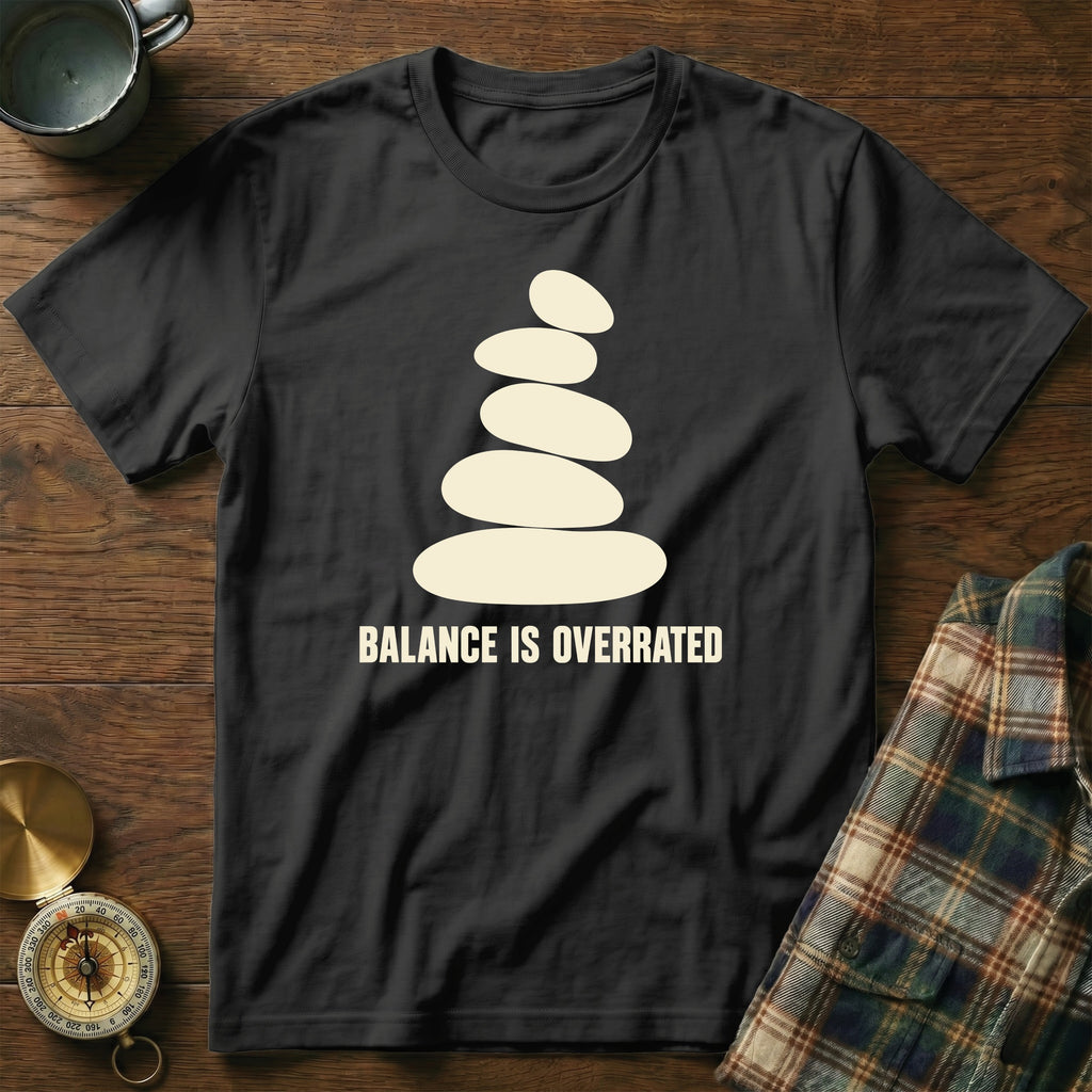 Black t-shirt with stacked stones graphic and text "BALANCE IS OVERRATED".