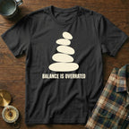 Black t-shirt with stacked stones graphic and text "BALANCE IS OVERRATED".