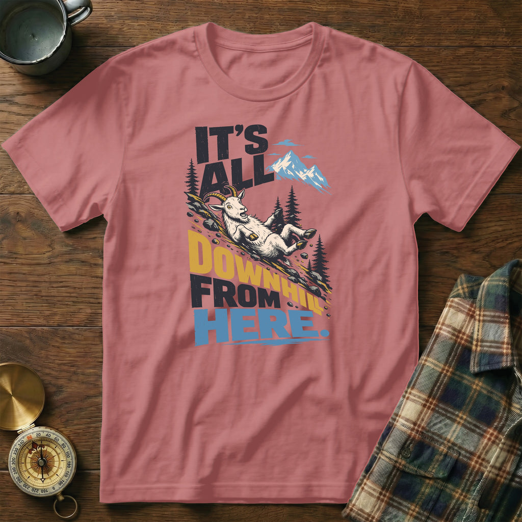 Dusty pink crewneck t-shirt featuring a mountain graphic and the text It's All Downhill From Here.