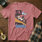 Dusty pink crewneck t-shirt featuring a mountain graphic and the text It's All Downhill From Here.
