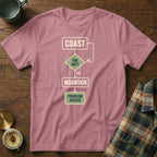Pink t-shirt with a flowchart graphic about choosing between coast and mountain.