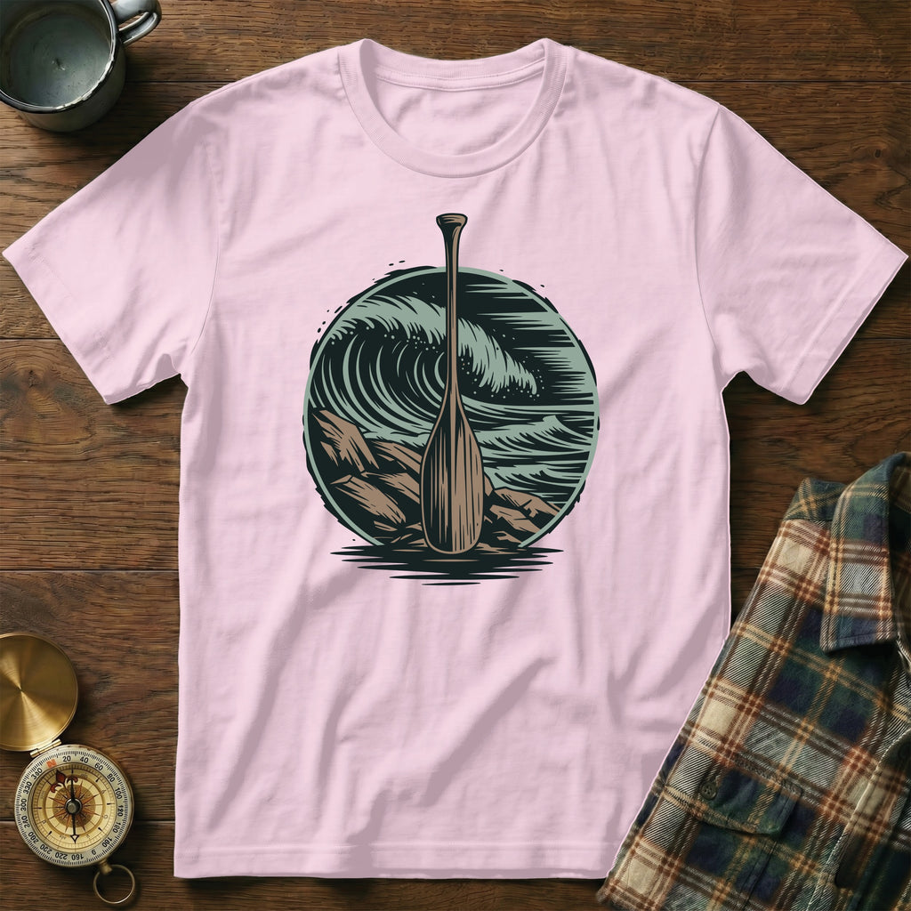 Pink t-shirt with a circular graphic of an oar in crashing waves.
