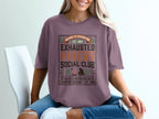 T-shirt with "Nature is Exhausting" and "Exhausted Social Club" text.
