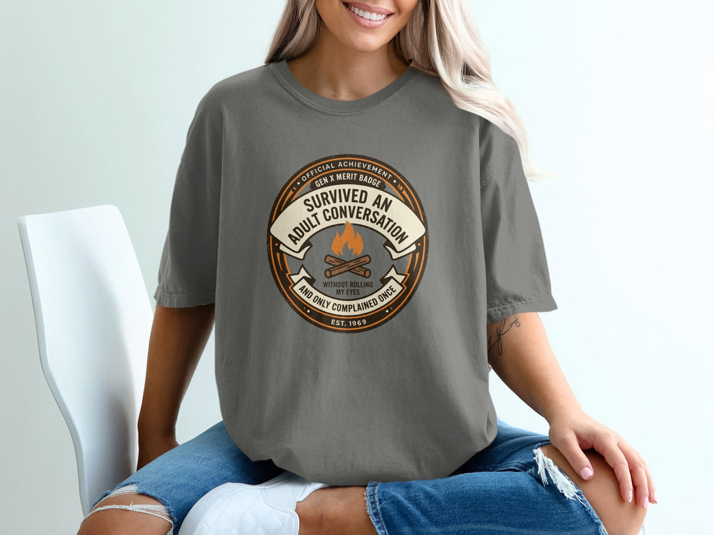 Gray t-shirt with "Survived An Adult Conversation" badge and "Est. 1969".