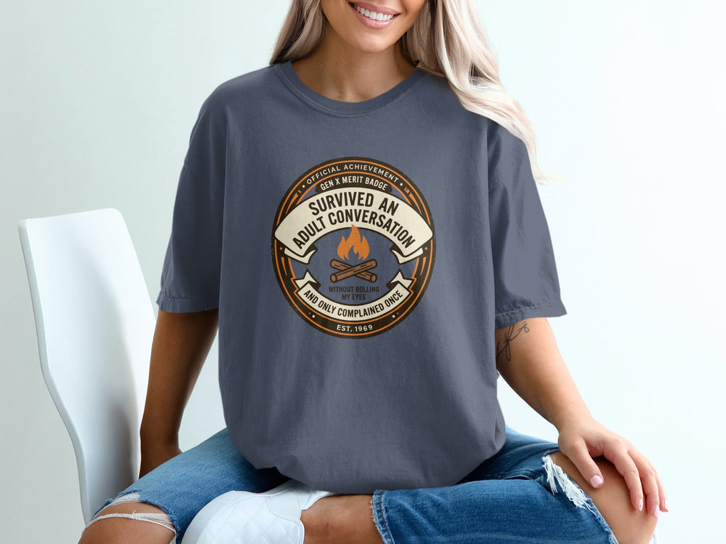 T-shirt with "Survived an adult conversation without rolling my eyes" badge.