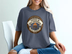 T-shirt with "Survived an adult conversation without rolling my eyes" badge.