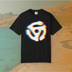 black t-shirt with a graphic of a white 45 RPM vinyl record adapter (dink) with a red, yellow, blue, and cyan chromatic aberration/glitch effect, ready for EDM festival apparel