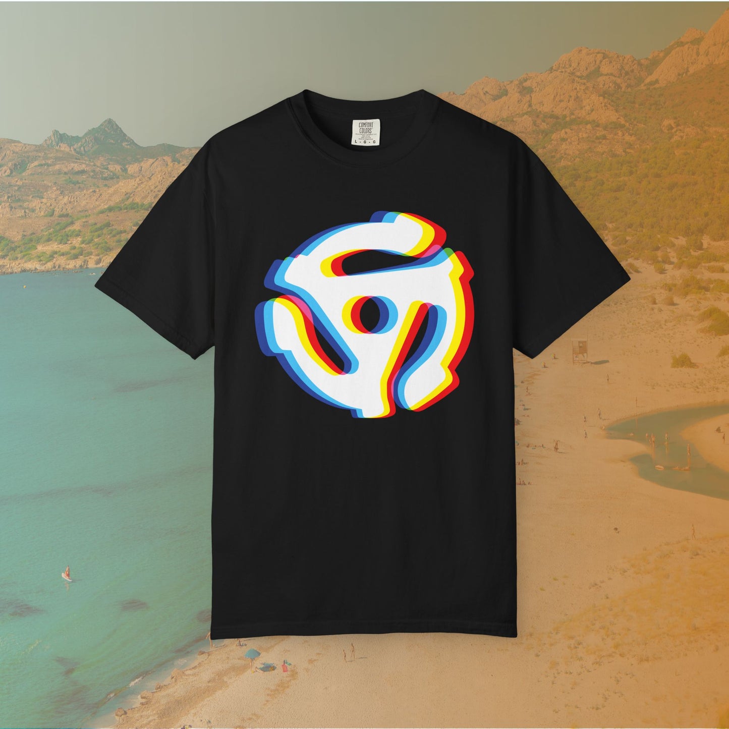 black t-shirt with a graphic of a white 45 RPM vinyl record adapter (dink) with a red, yellow, blue, and cyan chromatic aberration/glitch effect, ready for EDM festival apparel
