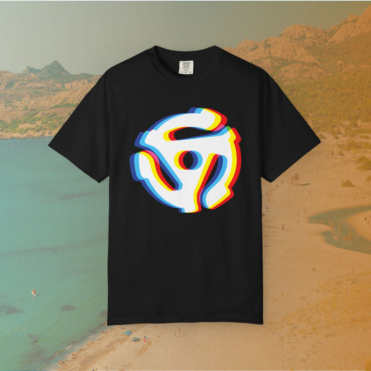 black t-shirt with a graphic of a white 45 RPM vinyl record adapter (dink) with a red, yellow, blue, and cyan chromatic aberration/glitch effect, ready for EDM festival apparel