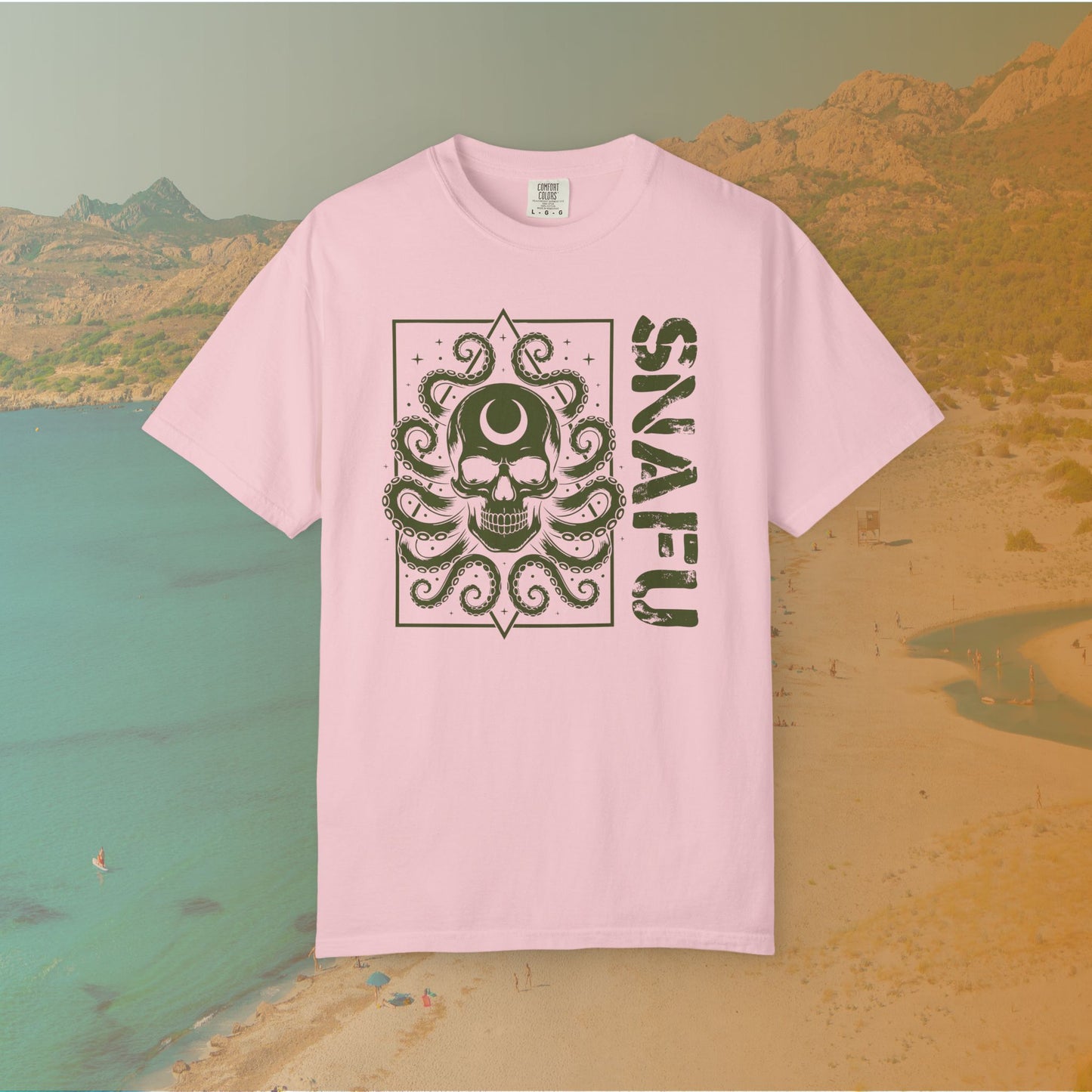 Pink t-shirt with a graphic design and 'SNFU' text on a scenic background