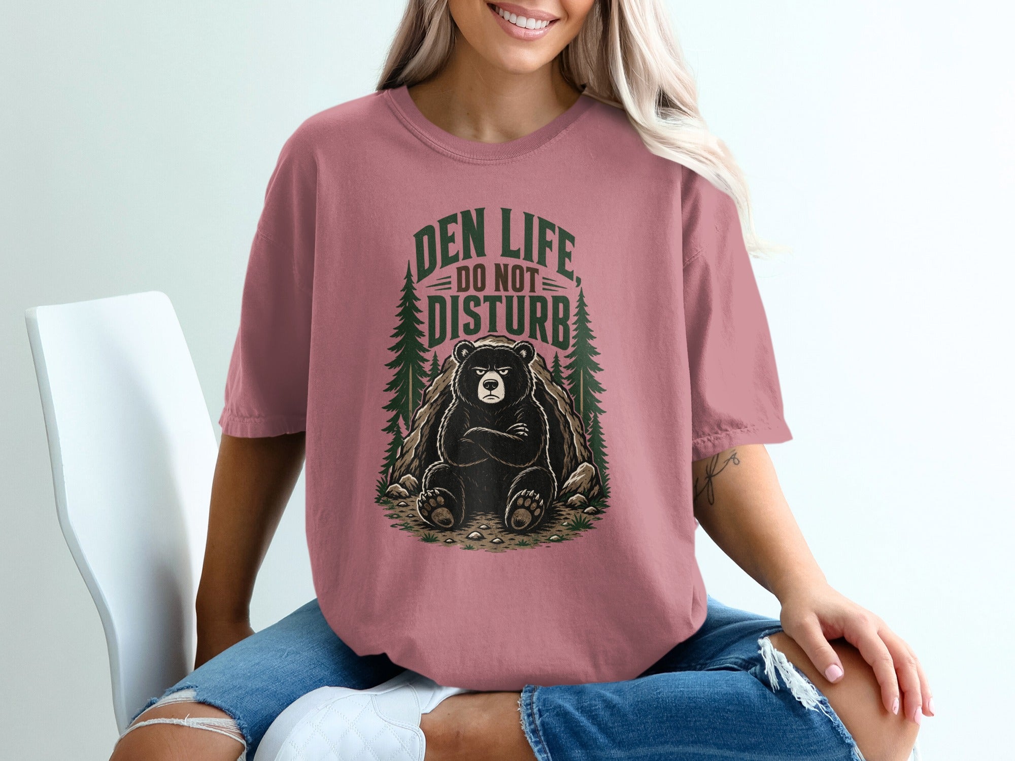 Bear sitting in a den with text "DEN LIFE DO NOT DISTURB".