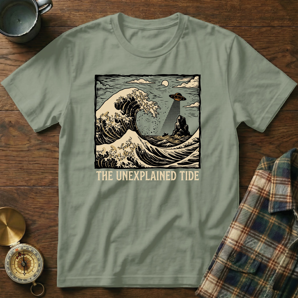 The Unexplained Tide t-shirt features a UFO and waves artwork.