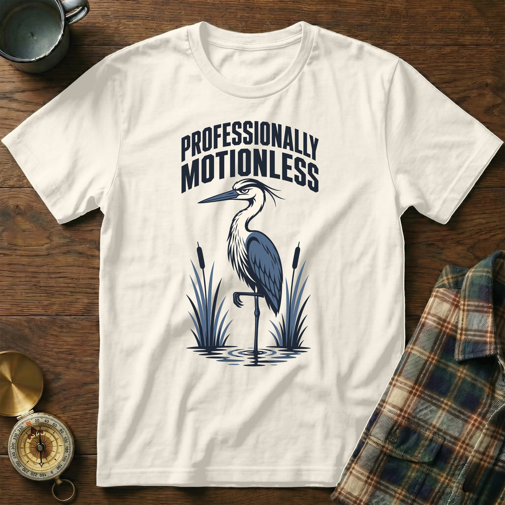 Cream t-shirt with heron graphic and text "Professionally Motionless".