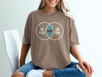 Brown t-shirt with intersecting circles graphic reading "The Plan", "Rarely", and "The Trail".