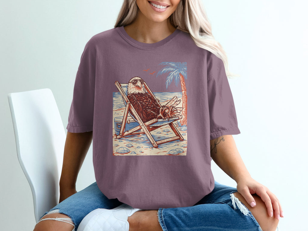 Eagle in sunglasses relaxing on a beach chair under a palm tree.