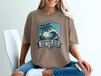 T-shirt with coastal graphic and text "Nowhere Near Done Exploring."